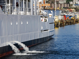 Research vessel discharging ballast water into lake