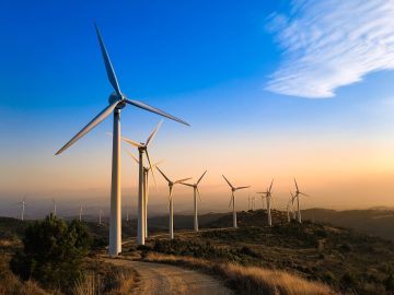 Wind farm in Navarre, Spain at sunset. Renewable energy concept.